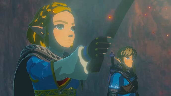 Zelda hält eine Fackel, während sie und Link in Tears of the Kingdom etwas betrachten